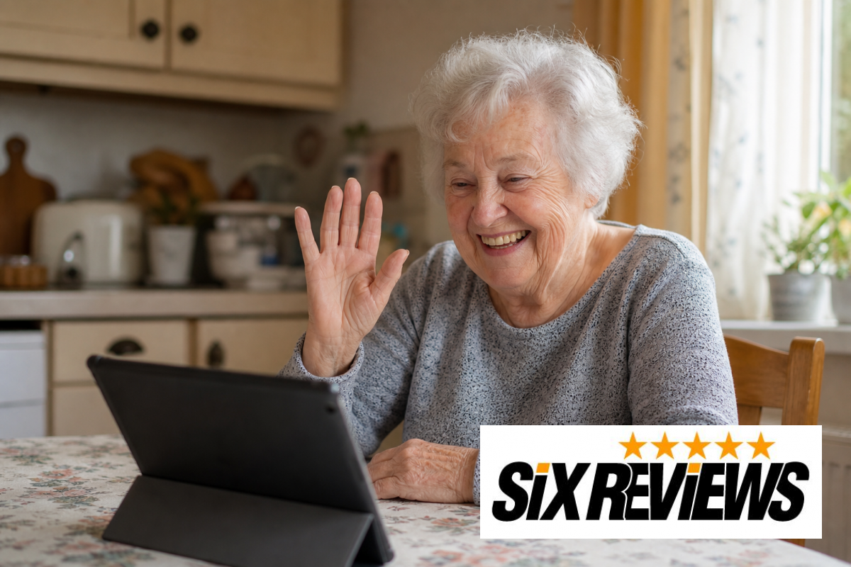 Senior woman smiling and waving during a video call on a tablet